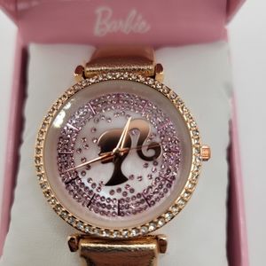Barbie Silhouette Quartz Movement Watch. Bronze Gold tone faux leather.